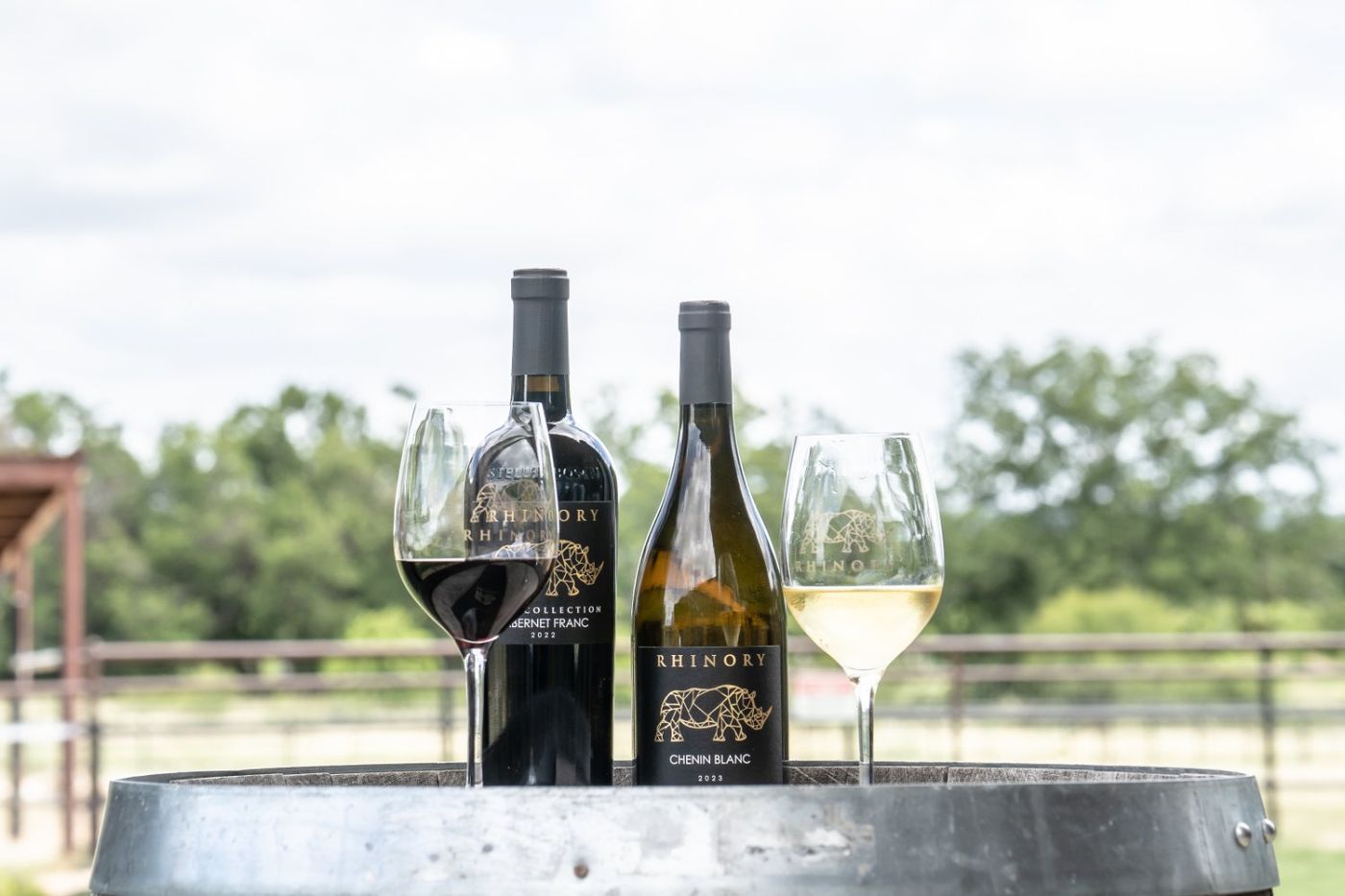 Keras Collection bottles and etched glasses on a barrel